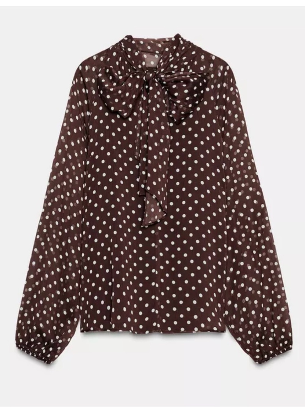 High collar blouse with back tie and long elasticized sleeves polka dot print.